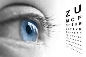 Close up of an eye and vision test chart