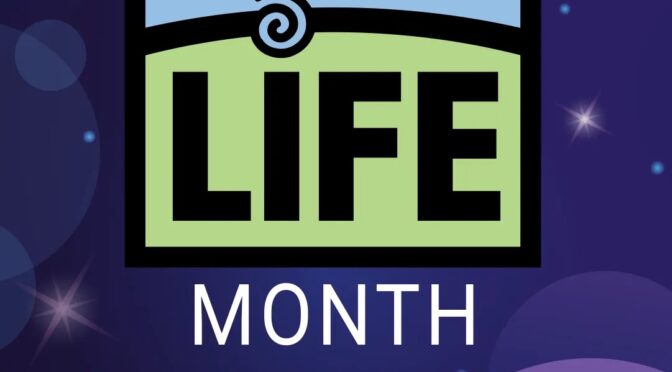 Blue and purple starry background with the Donate Life logo in the middle. Text reads April is National Donate Life Month.